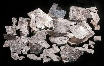Less Common Metals Neodymium flake used in the manufacture of permanent magnets