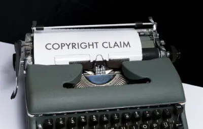 picture of a trpewriter with a piece of paper in it - on the paper is typed "Copyright claim" in large text